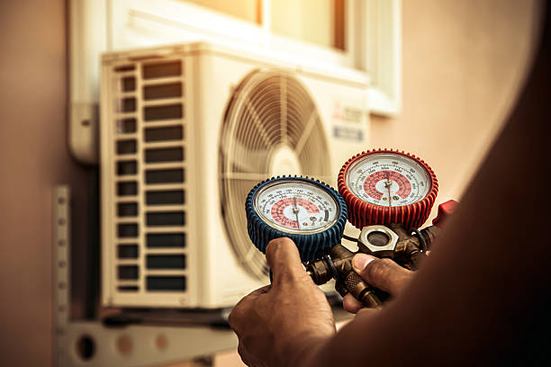 Professional Air Conditioning Service technician working in Shorewood, WI